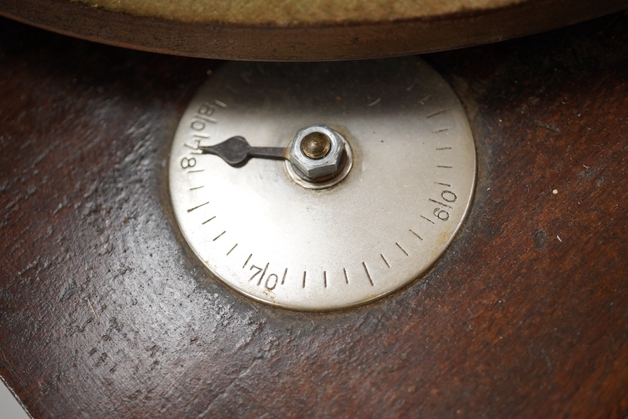 An HMV tabletop mahogany gramophone player with large laminated wooden horn, diameter of horn 55cm. HMV transfer labels to both body and horn. Condition - fair.